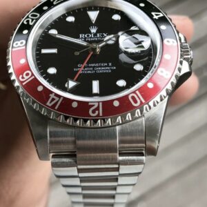 Rolex GMT-Master II “Coke” stainless steel watch.